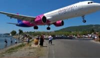 a plane flying over a road