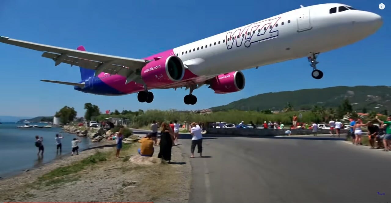 a plane flying over a road