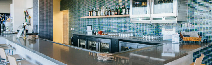 a bar with bottles on the wall