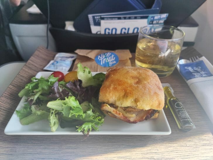 a plate of food and a glass of liquid