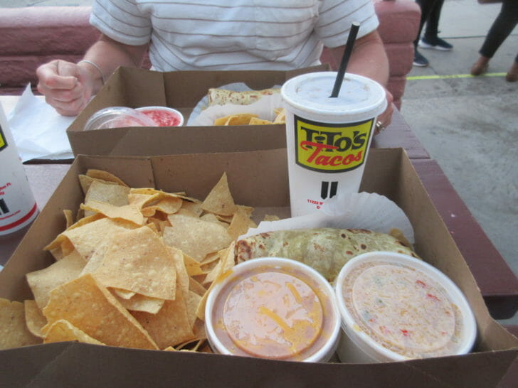 a box of food with a drink and a drink