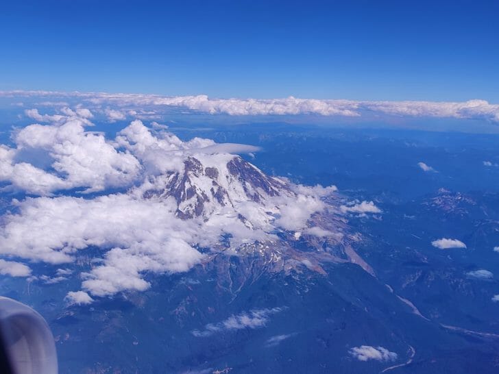 a mountain with clouds above it