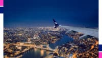 an airplane wing over a city