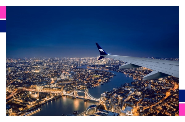 an airplane wing over a city