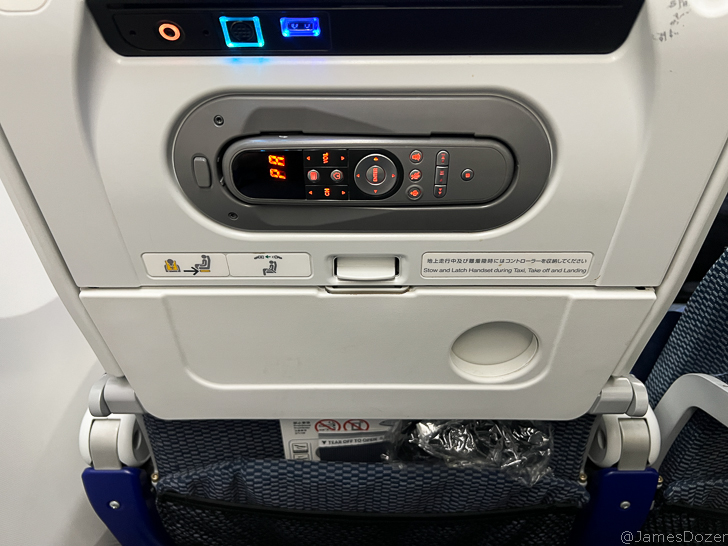 an airplane seat with a seat and a seat and a seat