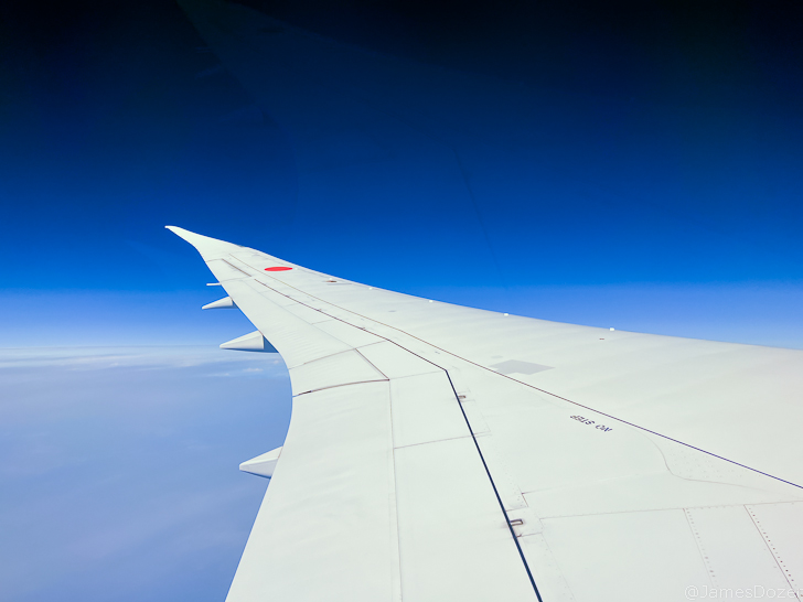 an airplane wing in the sky