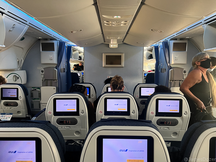 a group of people sitting in an airplane