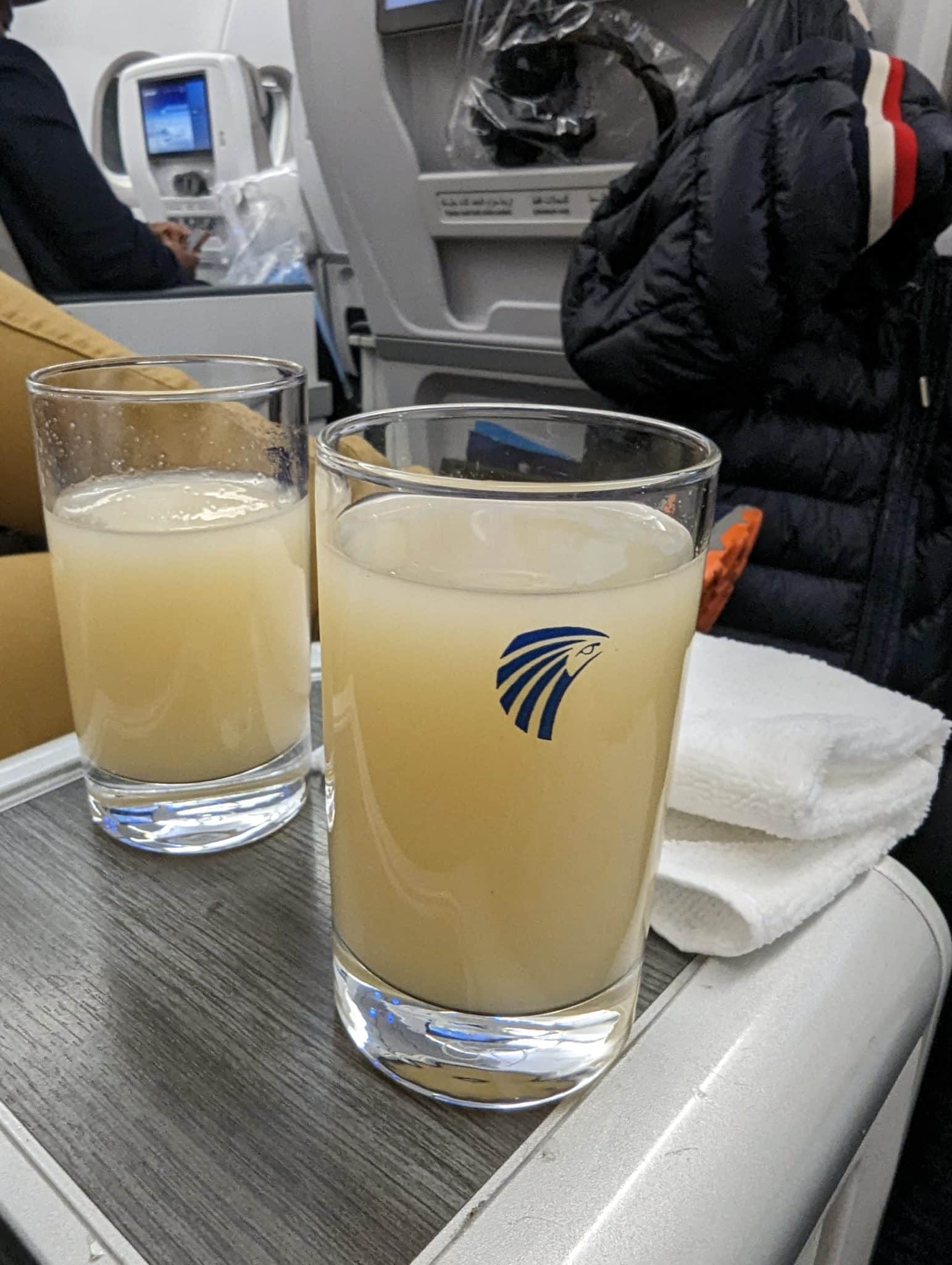 two glasses of liquid on a table