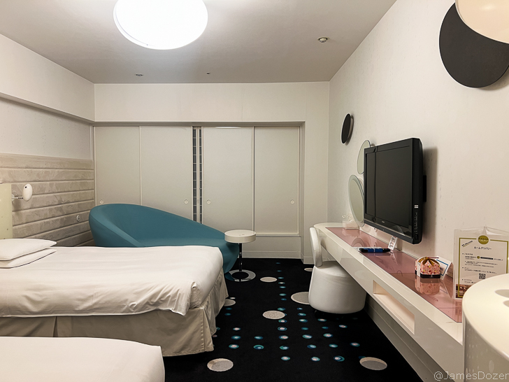 a room with a tv and a bed