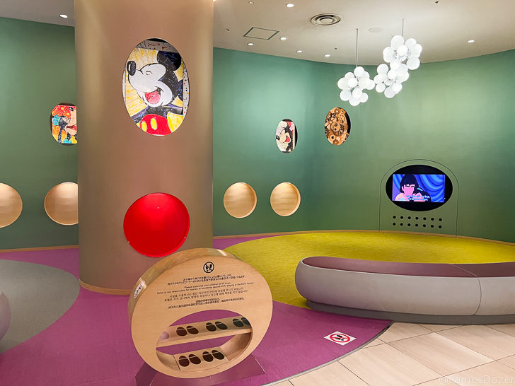 a room with colorful walls and round objects