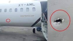 a plane with a hole in the side