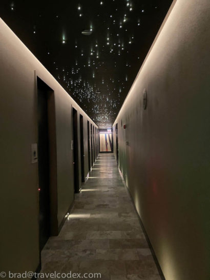 a hallway with lights on the ceiling