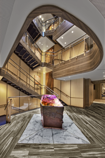 a staircase with a metal object on the floor