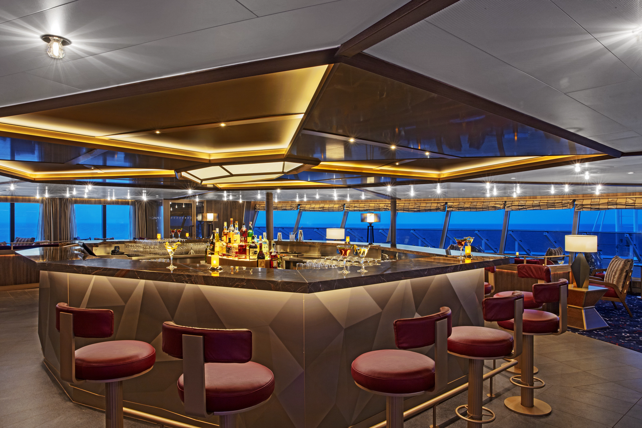 a bar with a counter and chairs