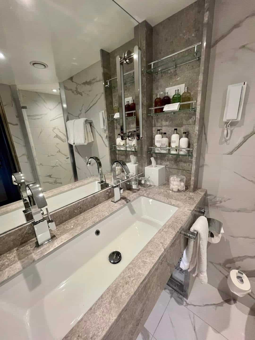 a bathroom with a marble countertop and a bathtub
