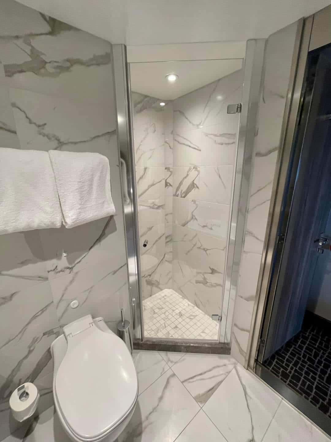 a bathroom with a glass shower door