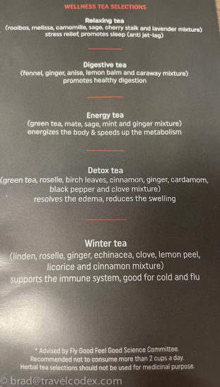 a list of teas on a black surface