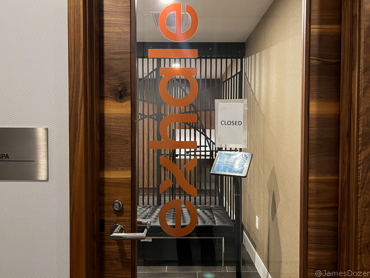 a glass door with a sign on it