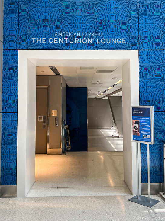 a blue wall with a sign on it