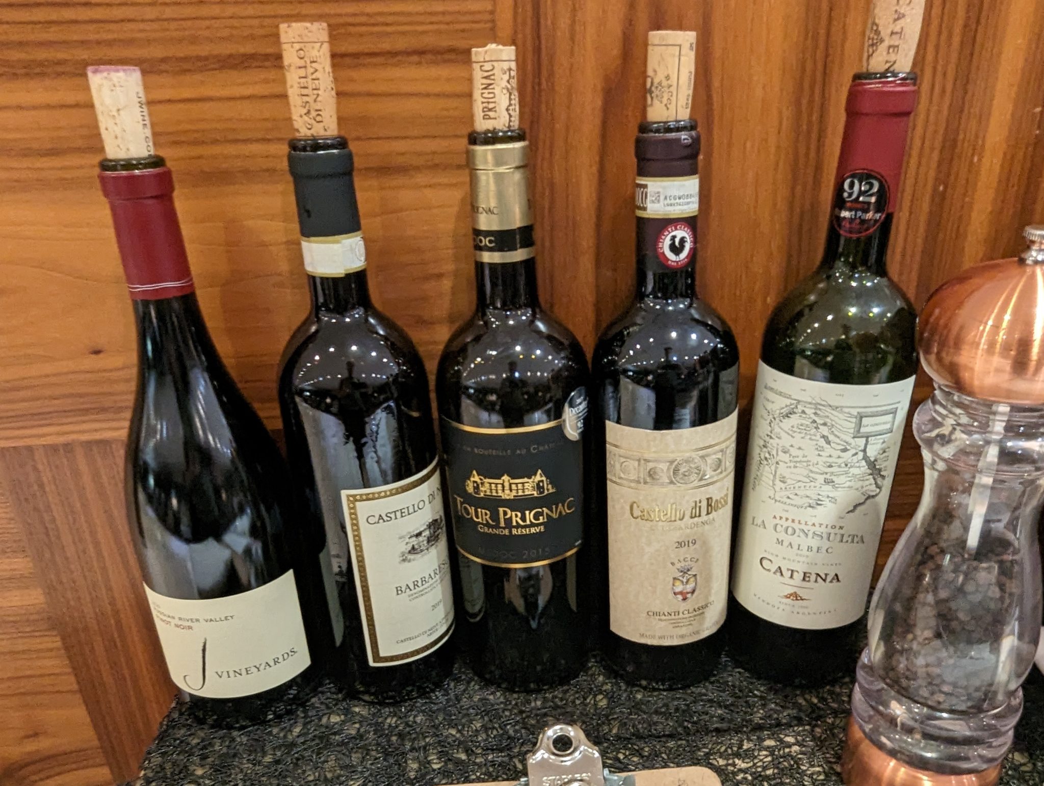 a group of wine bottles on a counter