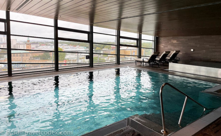 a indoor pool with a view of a city