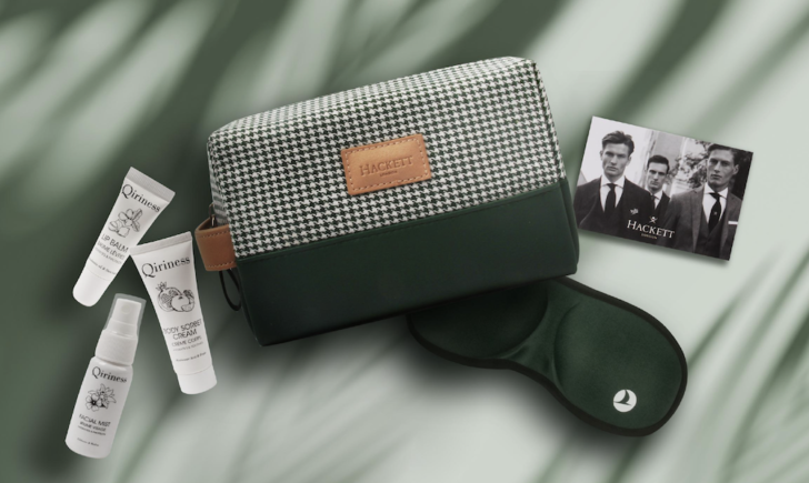 a green and white bag with a mask and a photo of a man
