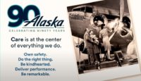 a group of people standing next to an airplane