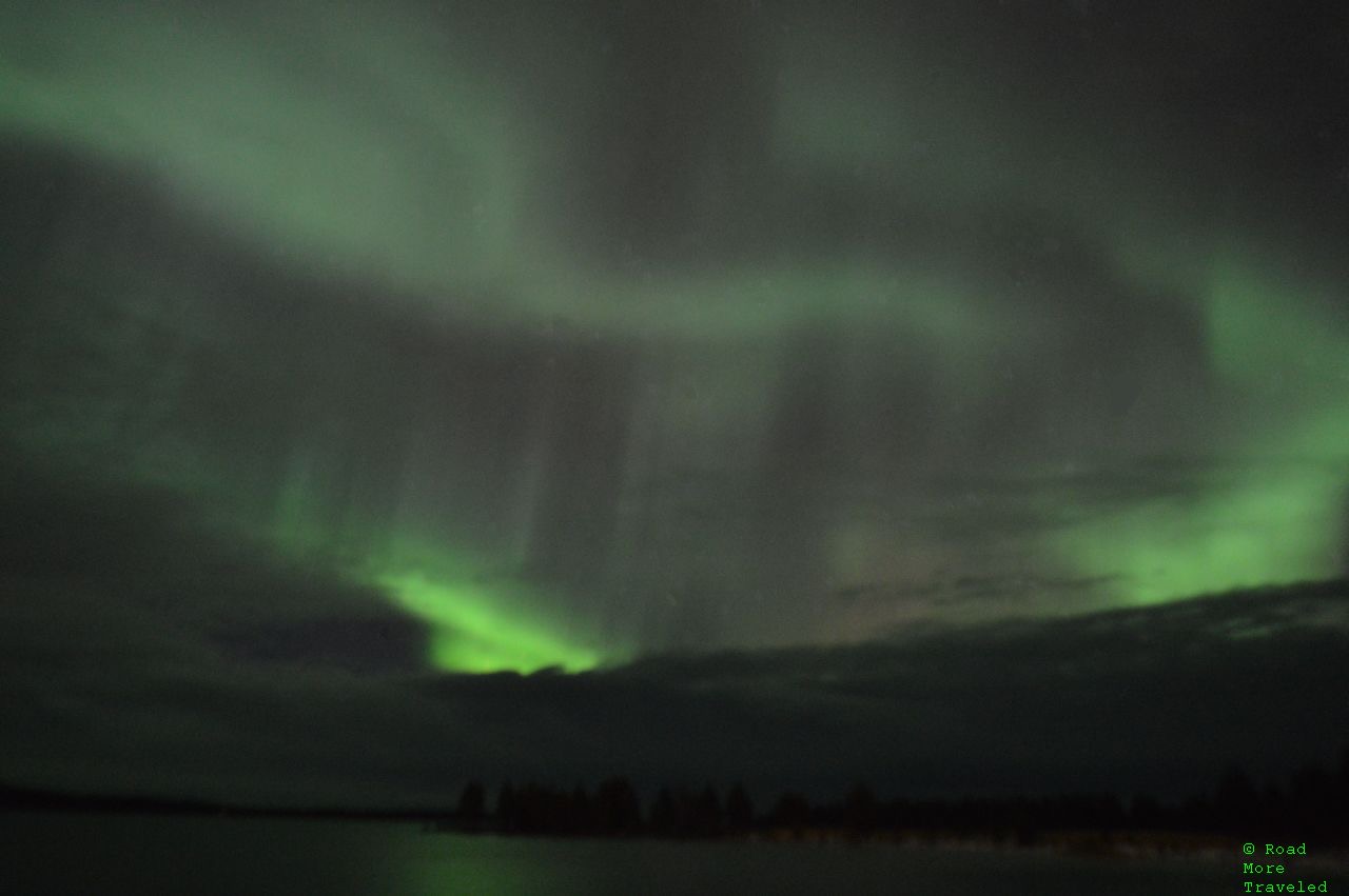 Aurora chasing in Finnish Lapland - dancing aurora over Lake Inari