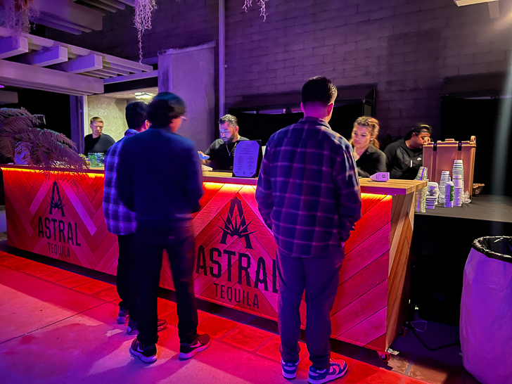 a group of people standing at a counter