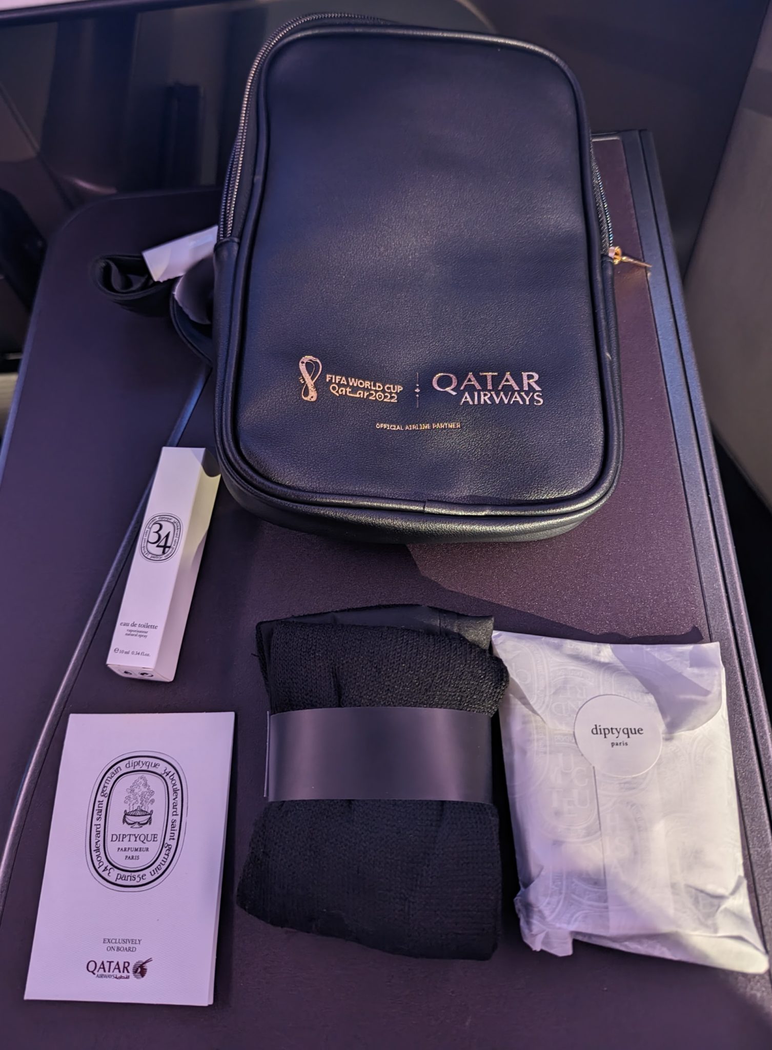 a black bag with a black object on a table