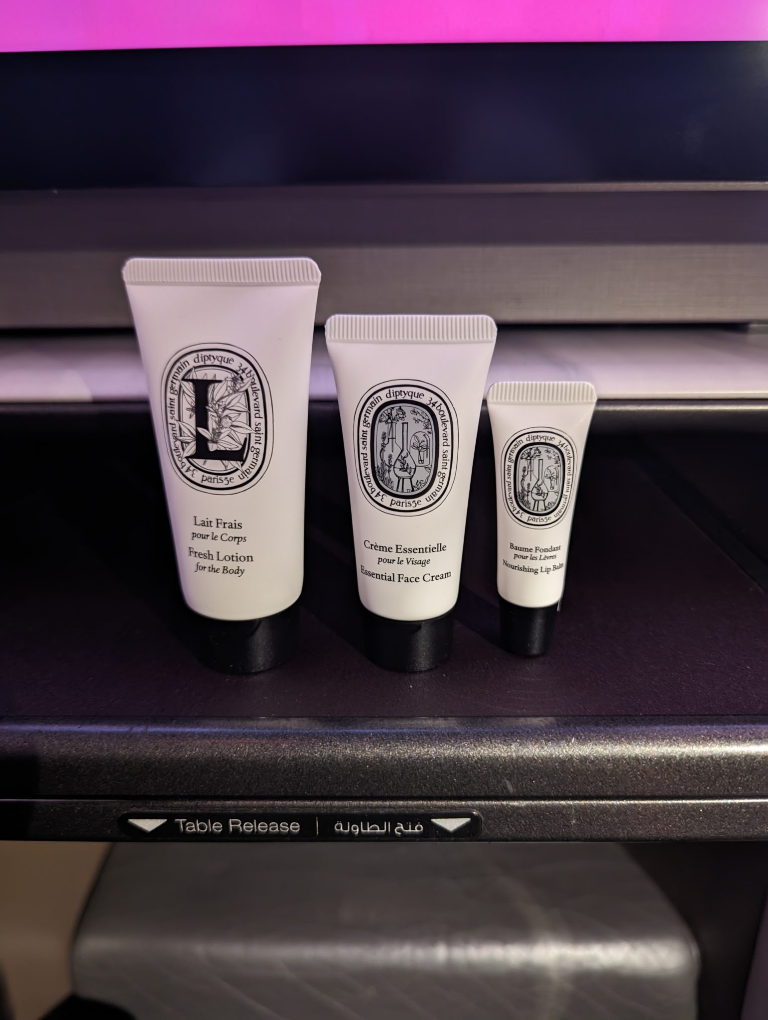 a group of white containers with black labels