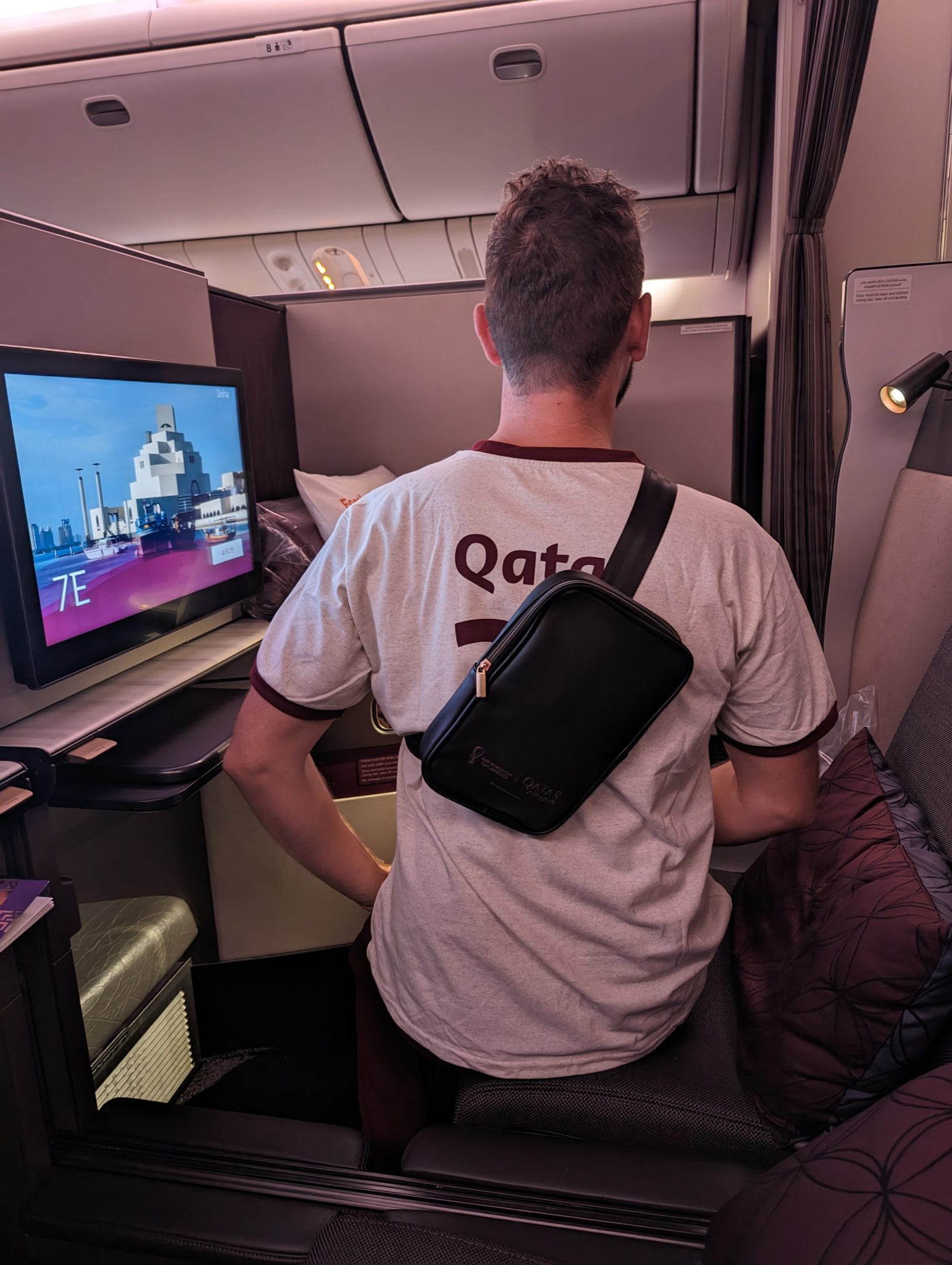 a man sitting on a couch in a plane