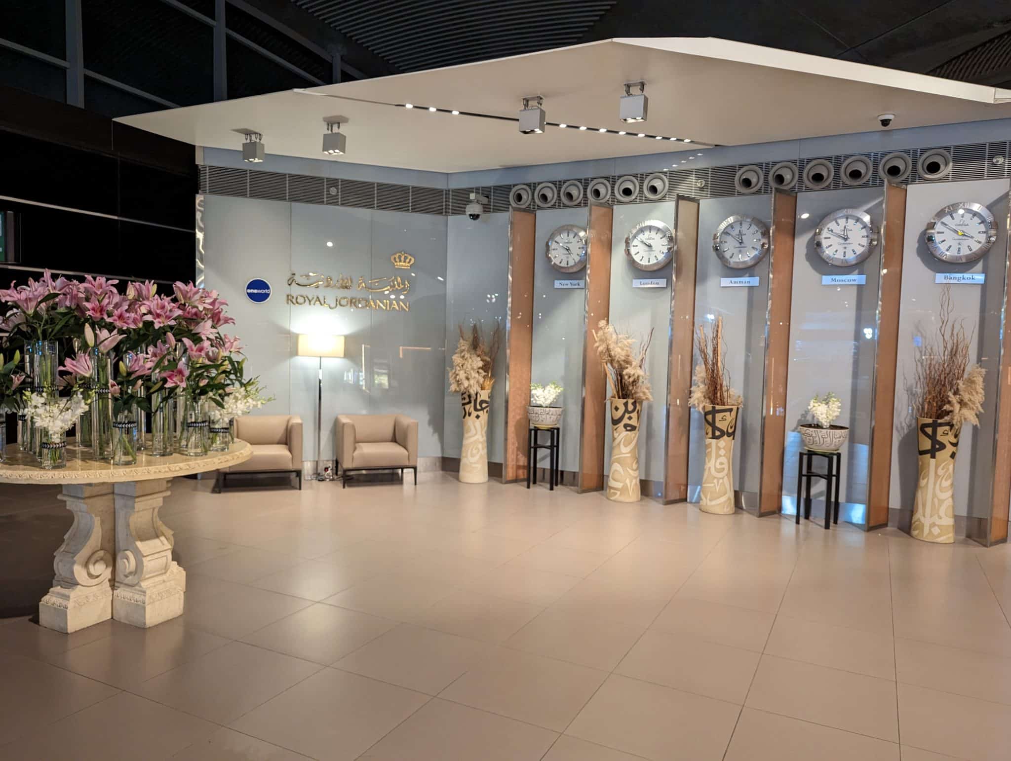 a room with clocks and chairs
