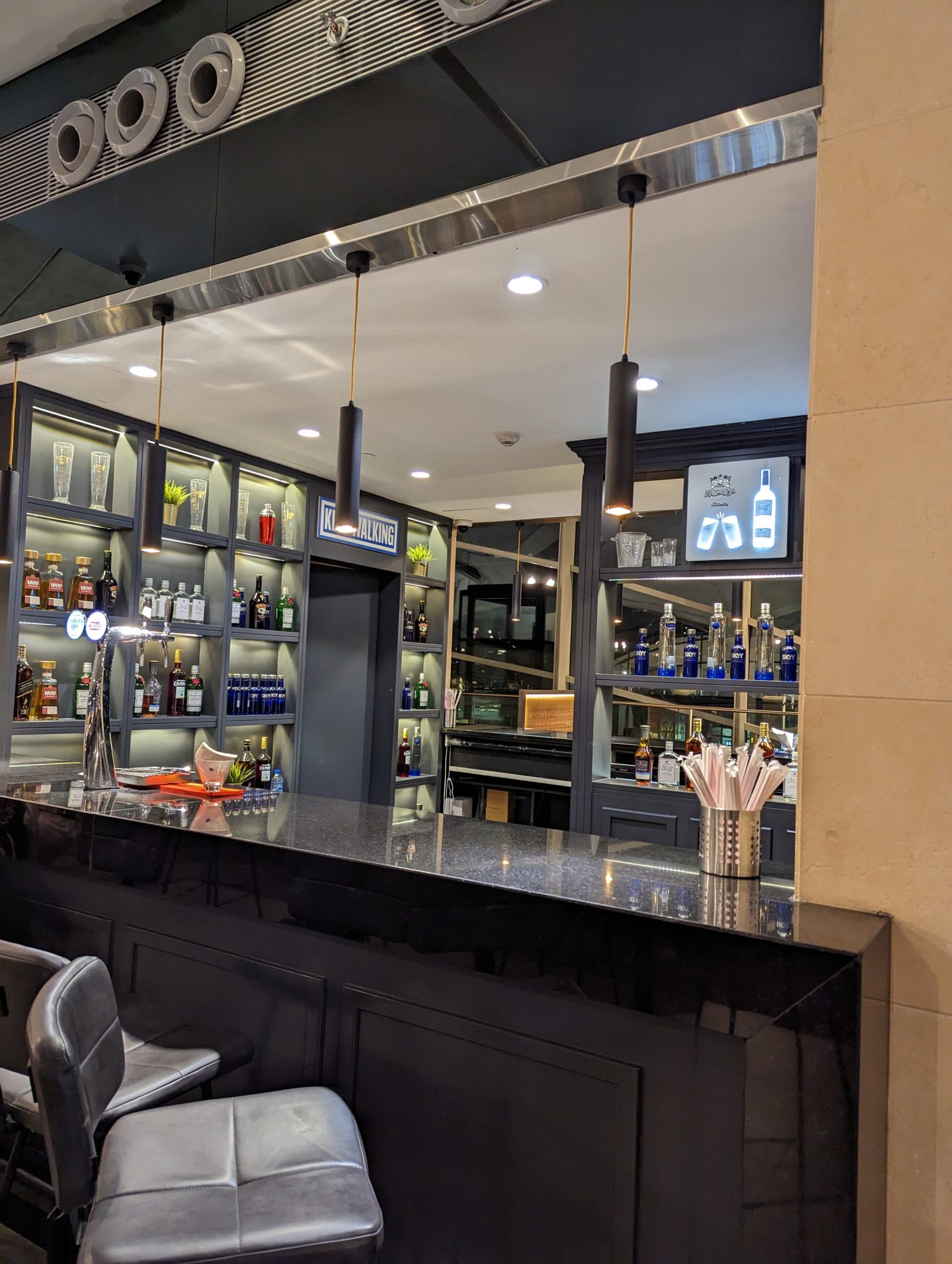 a bar with bottles and shelves