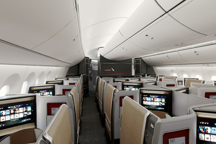 a plane with rows of seats and monitors