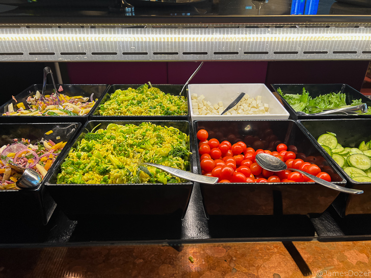 a salad bar with different types of vegetables