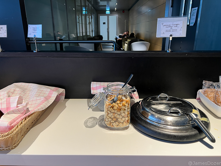 a glass jar with food in it and a lid on a counter