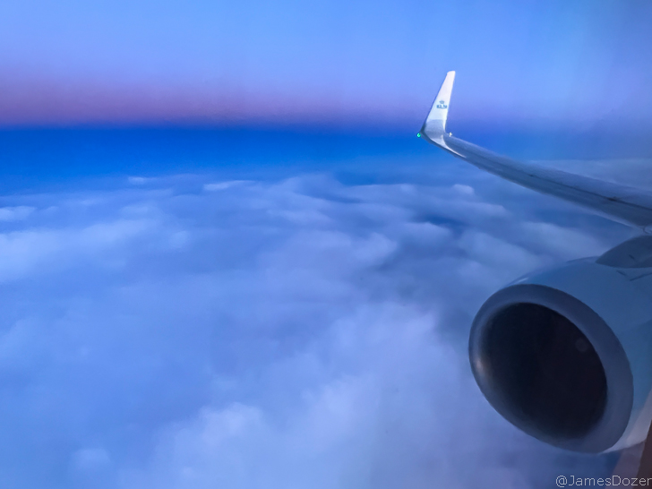 an airplane wing and the sky
