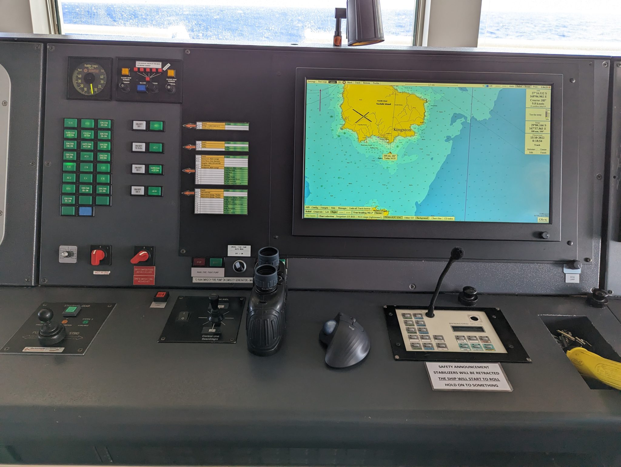a control panel with a computer and a map