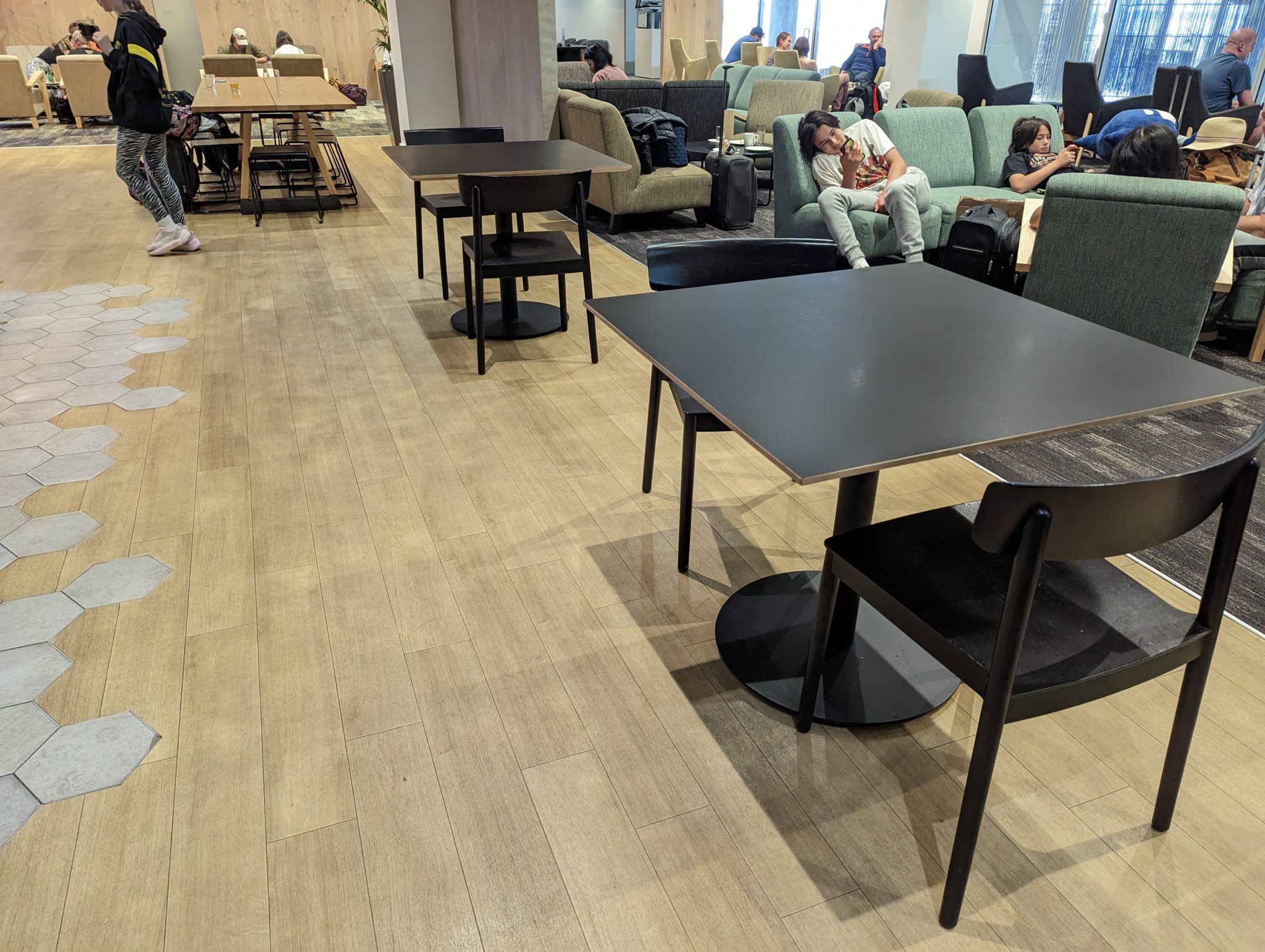 people sitting in chairs and tables