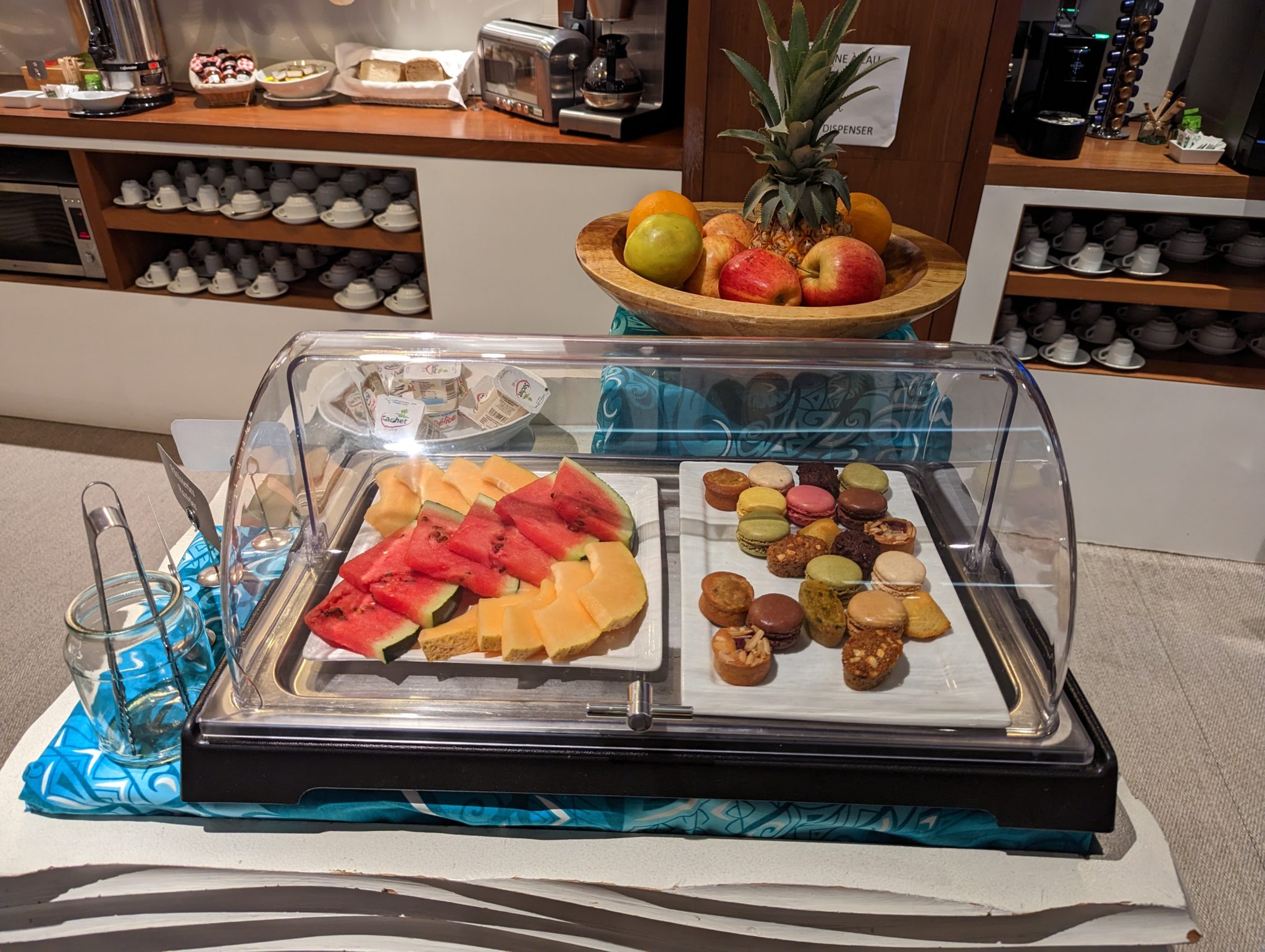 a tray of fruit and cookies on a table
