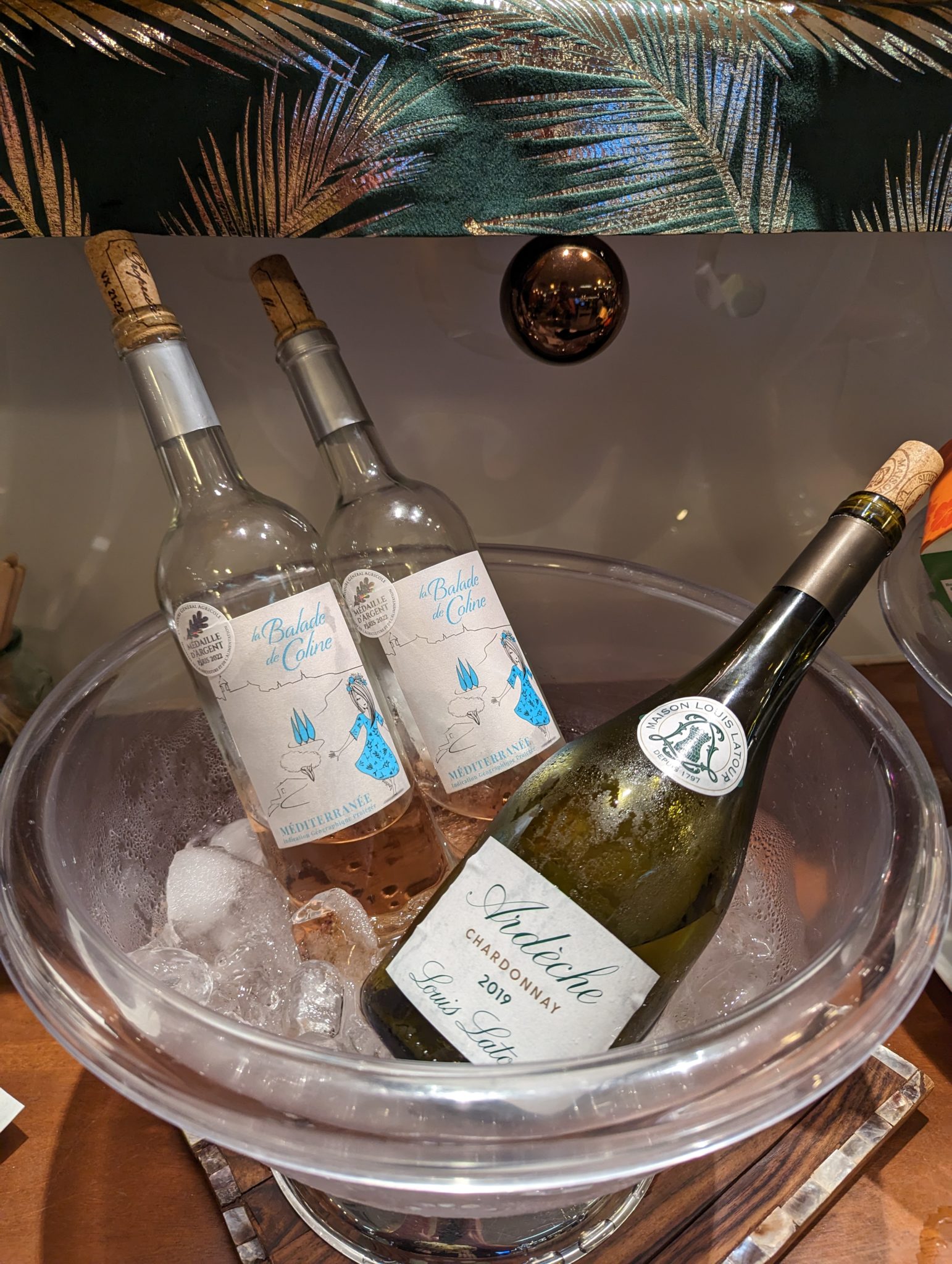 bottles of wine in a bowl of ice
