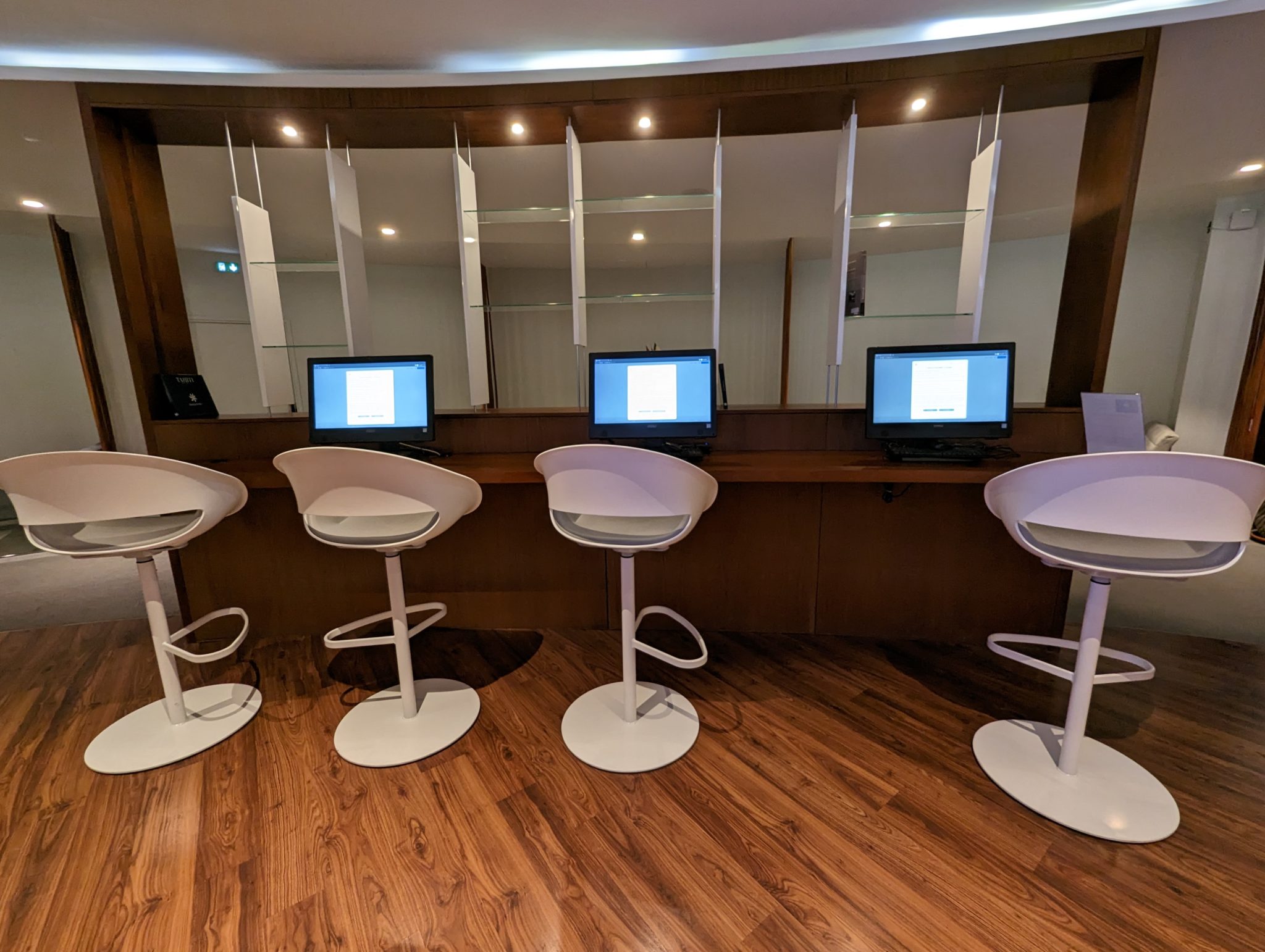 a row of chairs and computers in a room