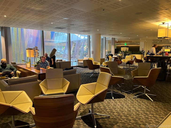 a room with many chairs and tables
