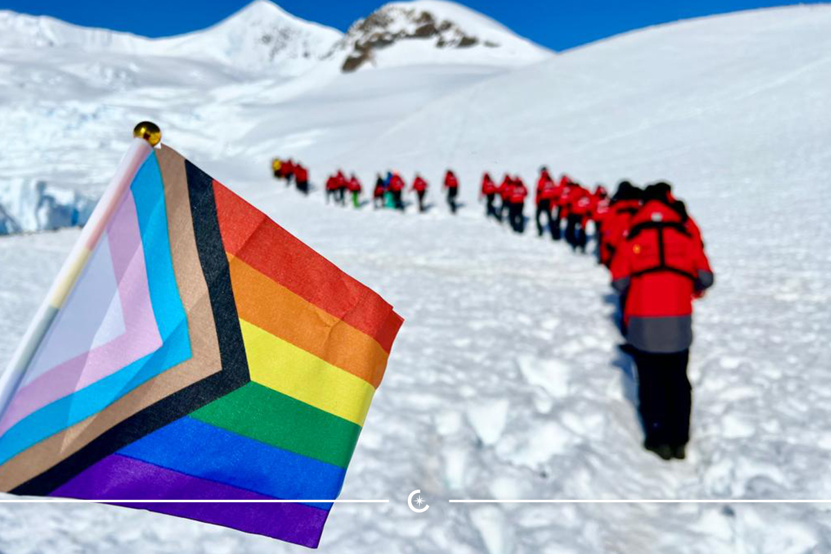 a group of people walking on a snowy mountain