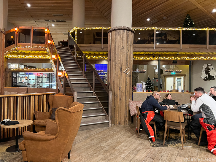 a couple of people sitting at a table in a restaurant