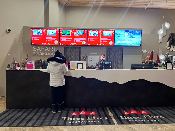 a person standing at a reception desk