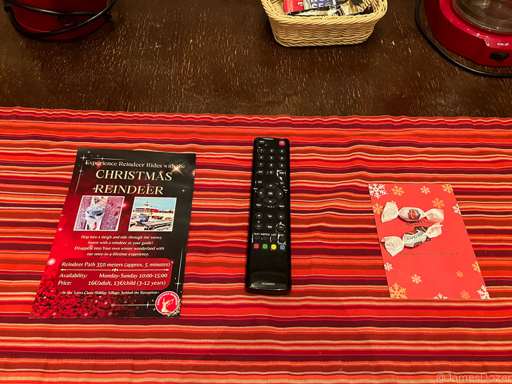 a remote control and a book on a table