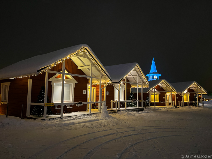 a row of houses with lights on