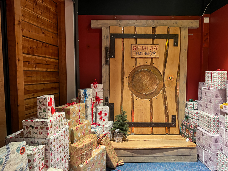 a wooden door with presents in front of it